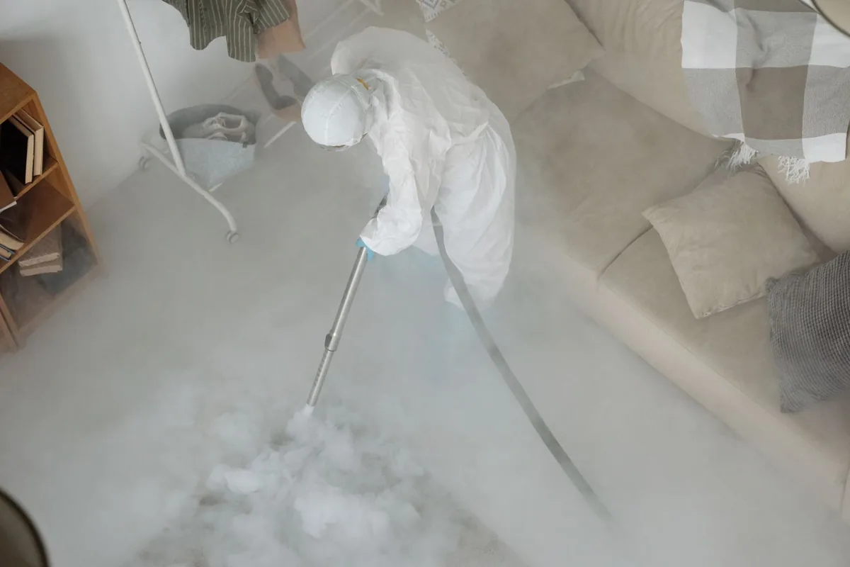 Biohazard cleanup technician in protective equipment, Midland, MI